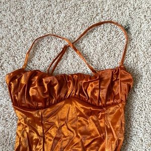 Orange, satin corset bodysuit with underwire
